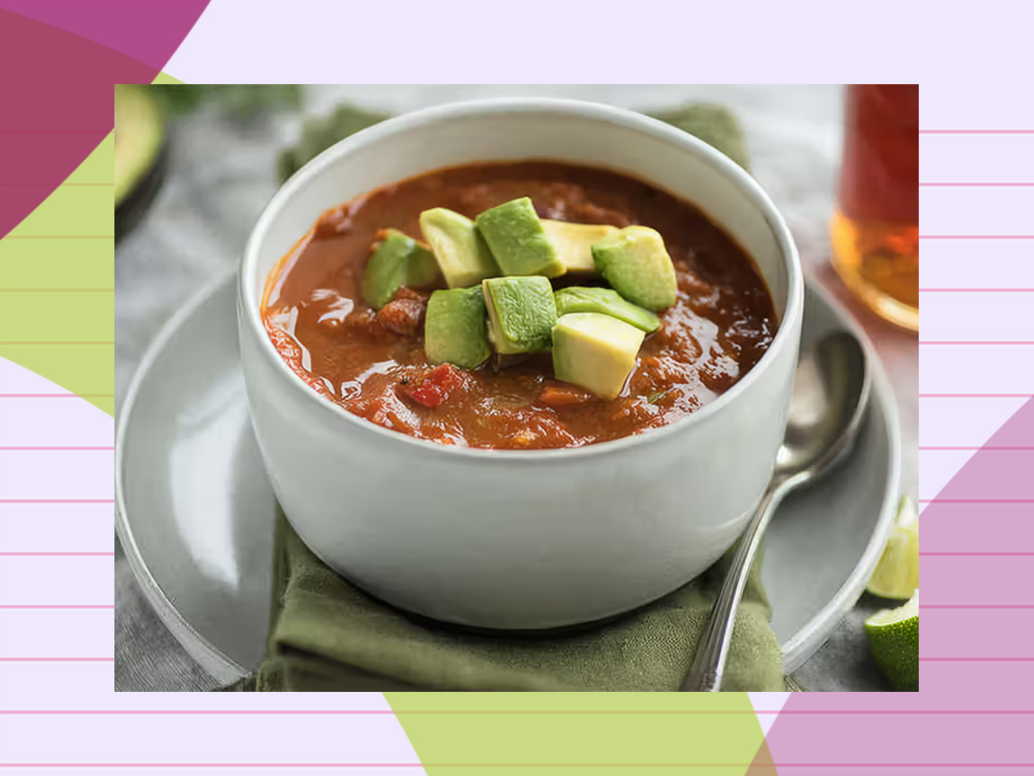 A bowl of pumpkin chili topped with diced avocado